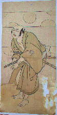 Actor as a samurai, crouching and looking right