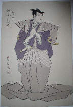 Actor in purple kimono looking to his left